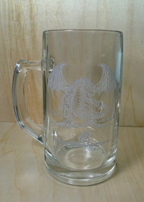 Clear glass mug with handle on a wooden surface